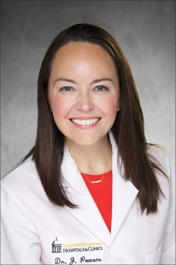 Dr. Powers, a woman in a white coat.