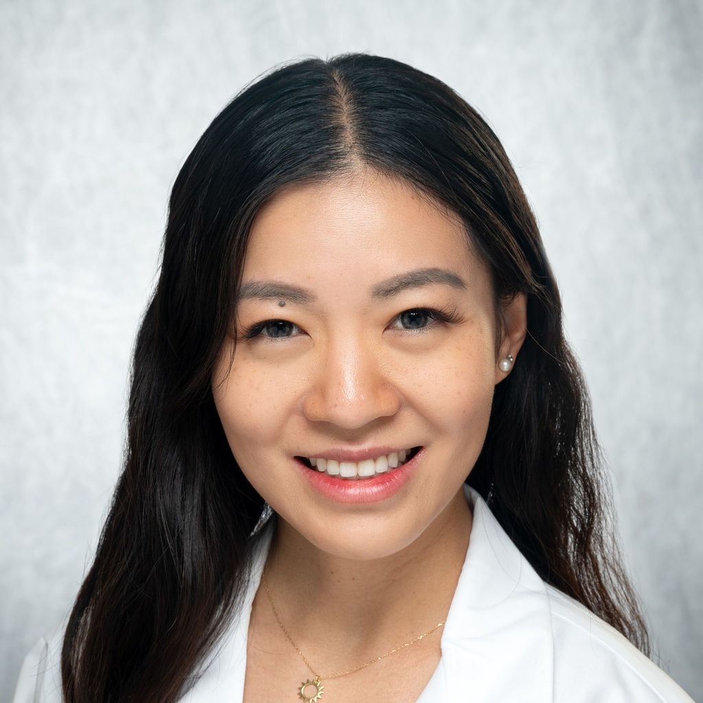 Dr. Chen, a dark-haired woman in a white coat.