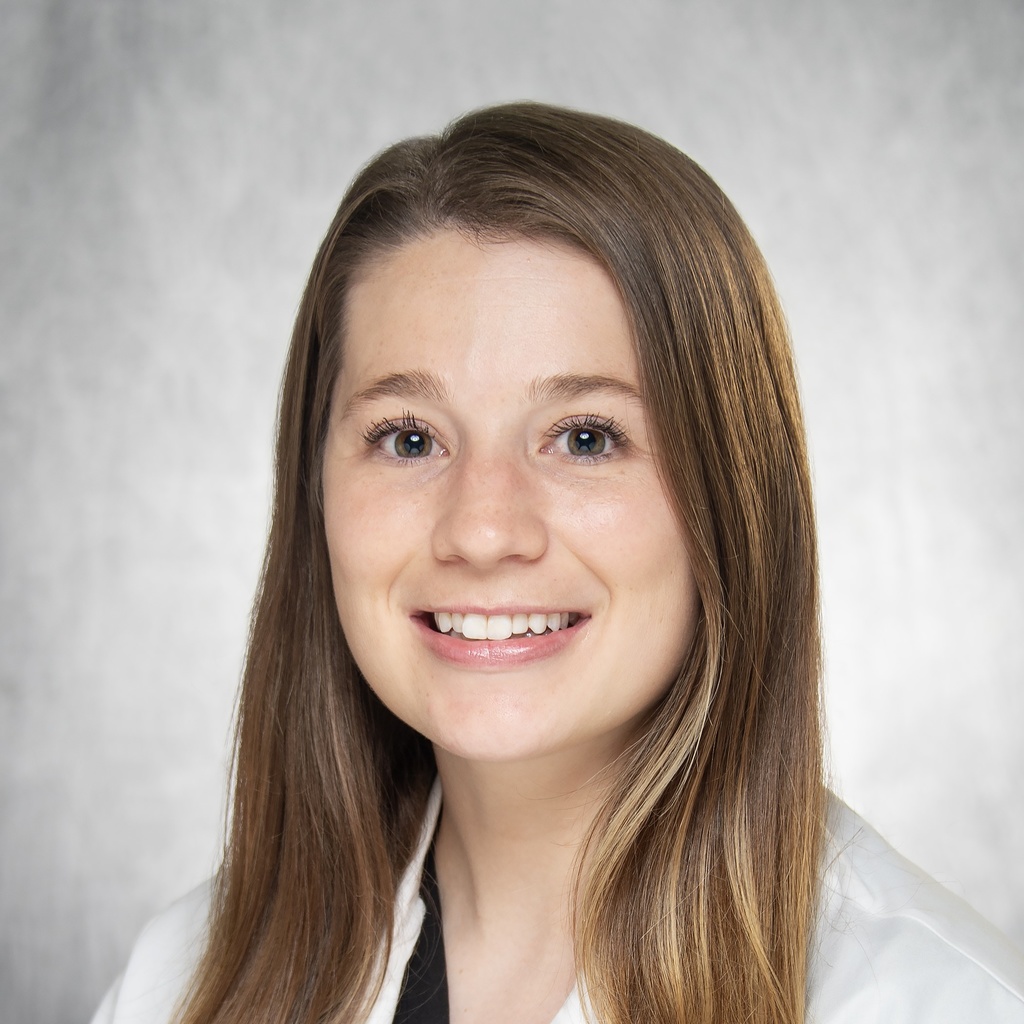 Dr. Burdick, a brown-haired woman in a white coat.