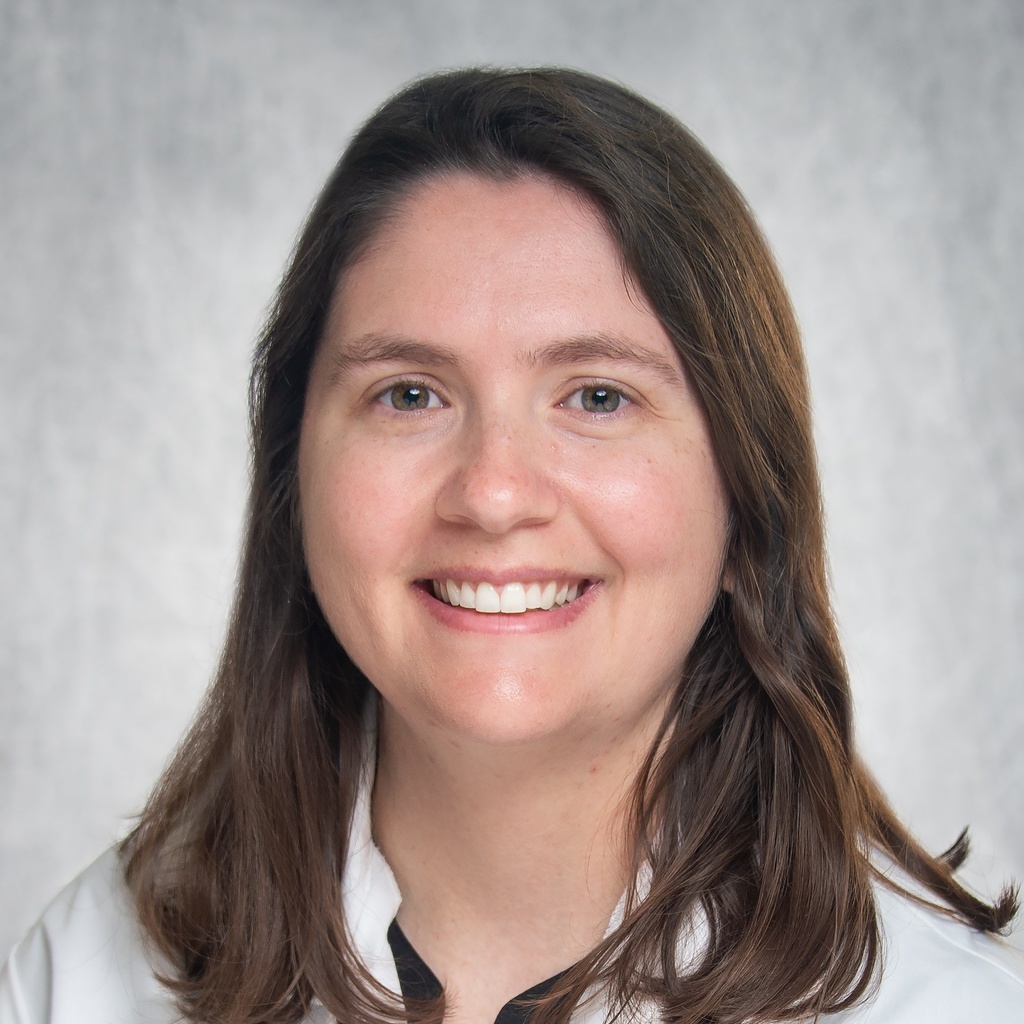 Dr. Thompson, a dark-haired woman in a white coat.