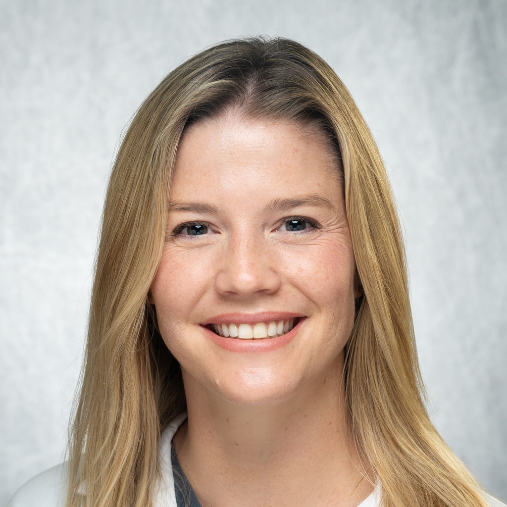 Dr. Minion, a blonde woman in a white coat.