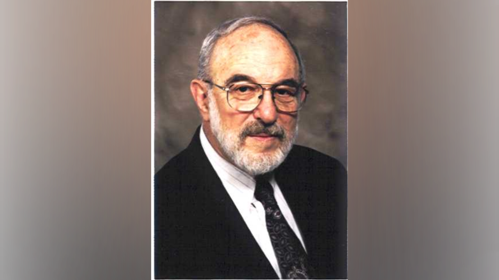 Dr. Strauss, a bearded man wearing glasses.